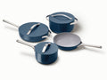 Caraway ceramic cookware set in Navy with four pans, three matching lids.