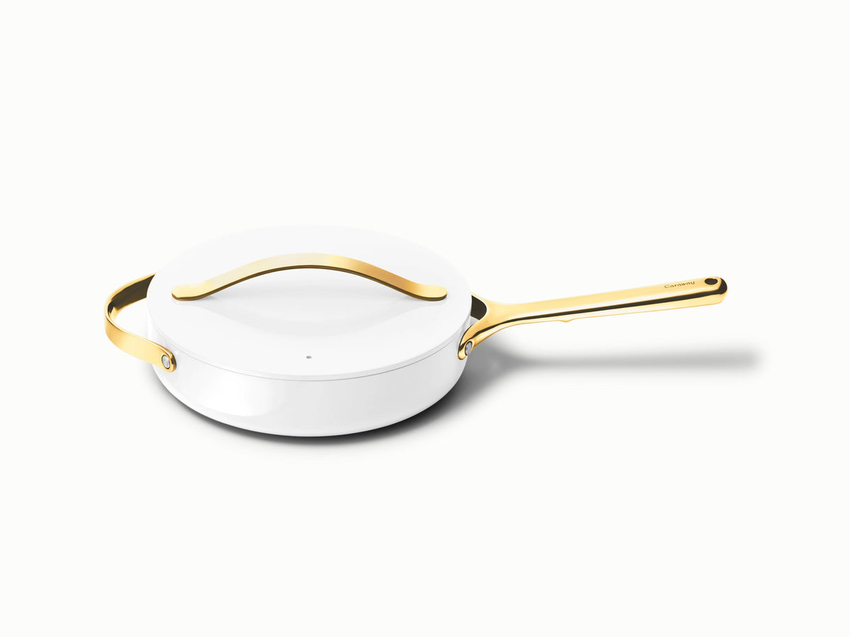 Caraway ceramic small sauté pan in White with a matching lid.