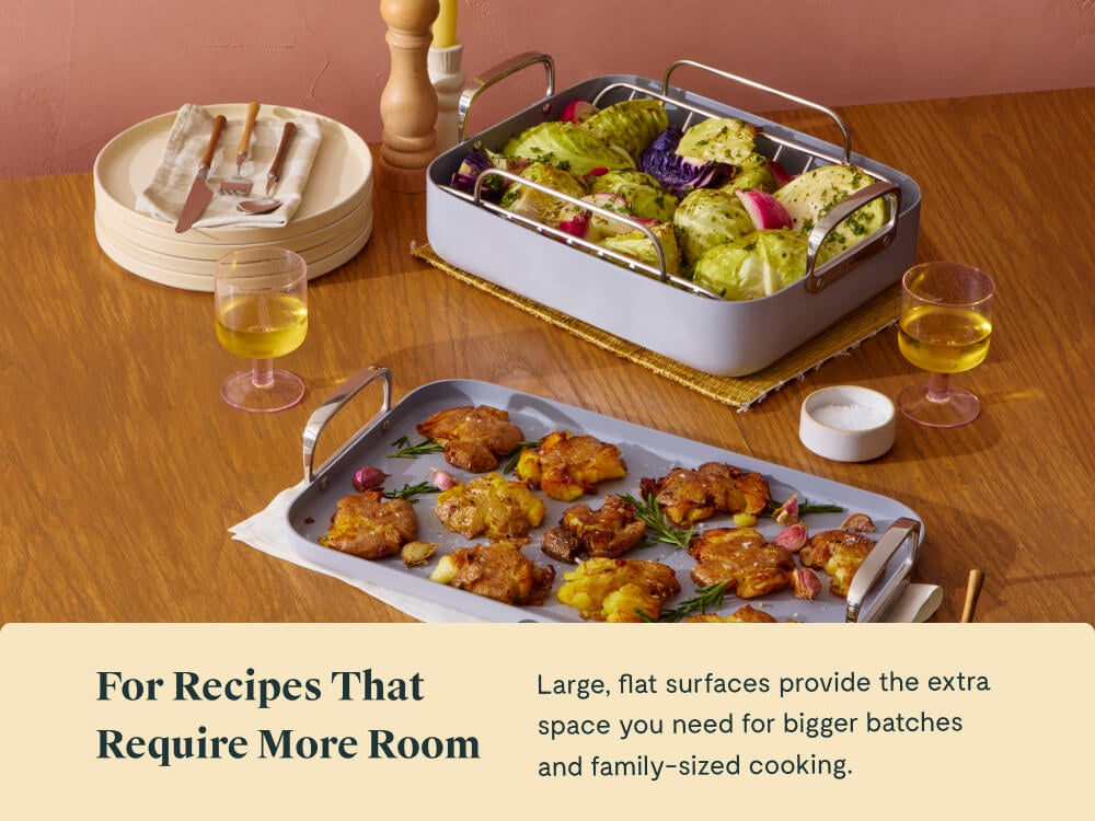 Caraway roasting pan and double burner griddle serving vegetables on a dining table.