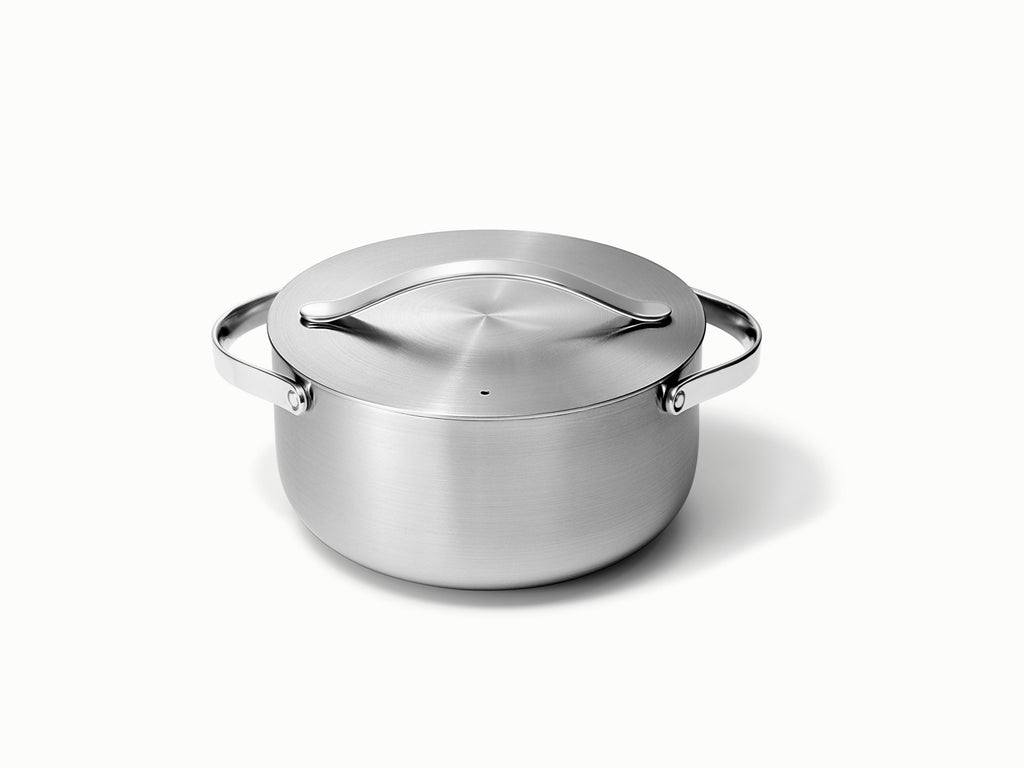 Caraway stainless steel dutch oven with a matching lid.