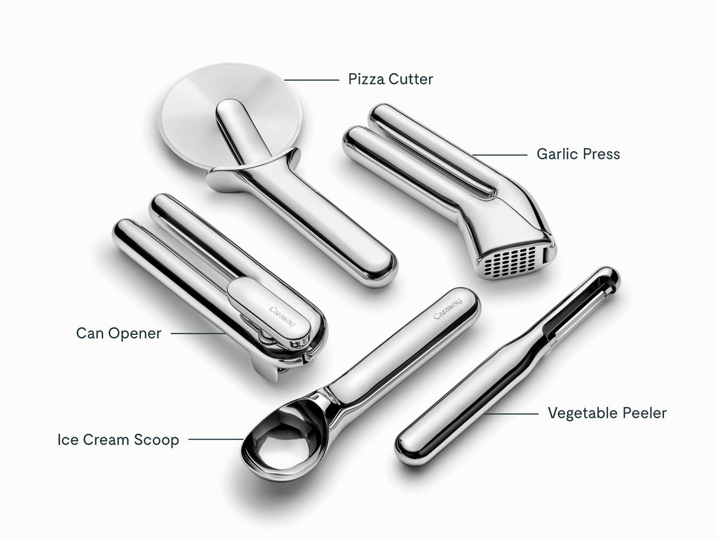 Caraway stainless steel can opener, pizza cutter, garlic press, ice cream scoop, and vegetable peeler shown with labels.