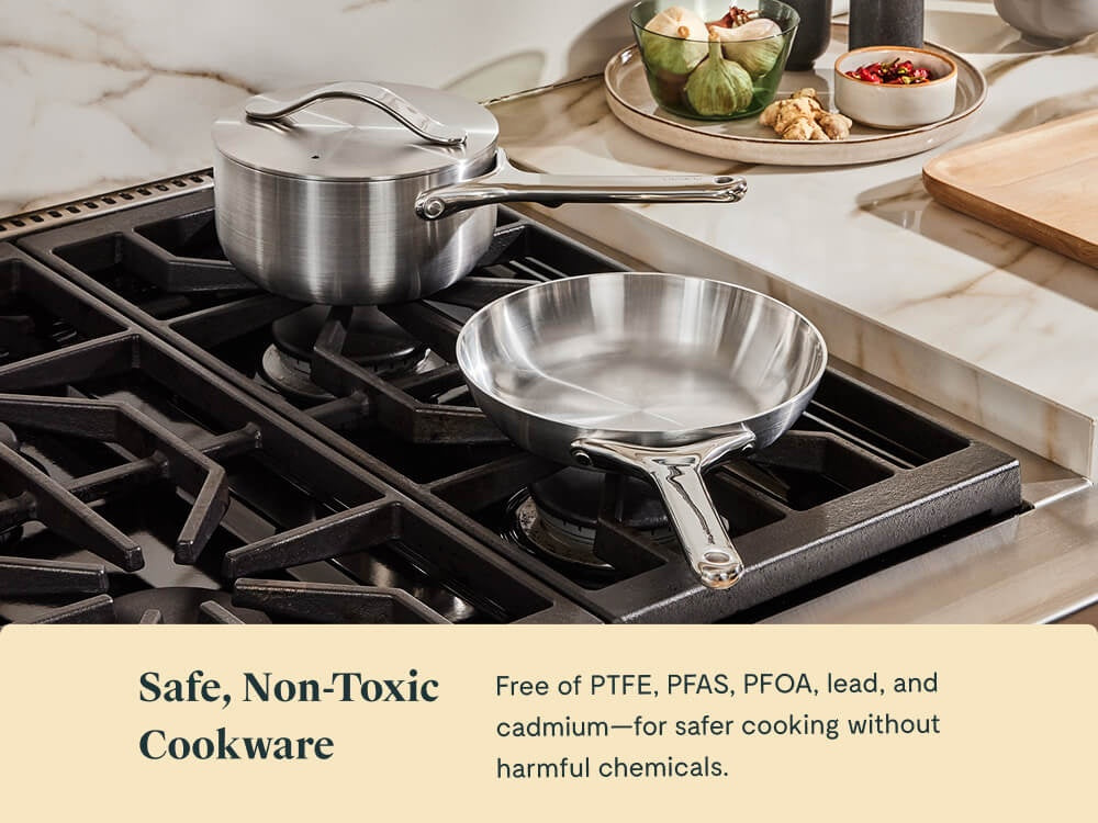 Caraway stainless steel mini fry pan and lidded mini sauce pan on a stove.