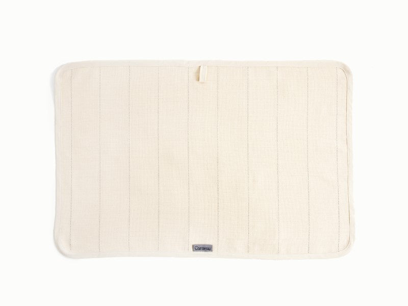 Caraway Cream tea towel laid flat to show the fabric and stitching.